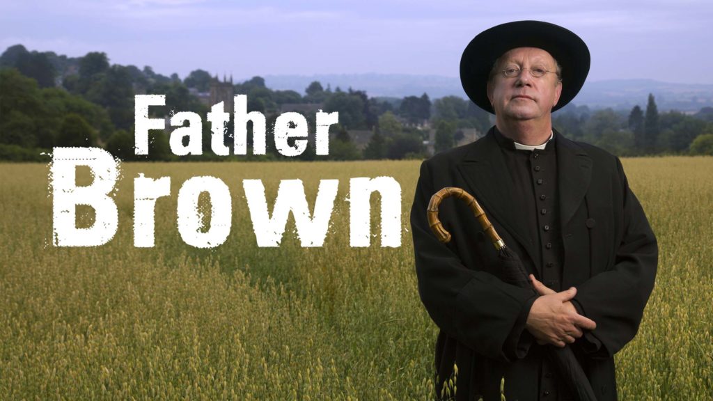 Promo of Father Brown standing in a field